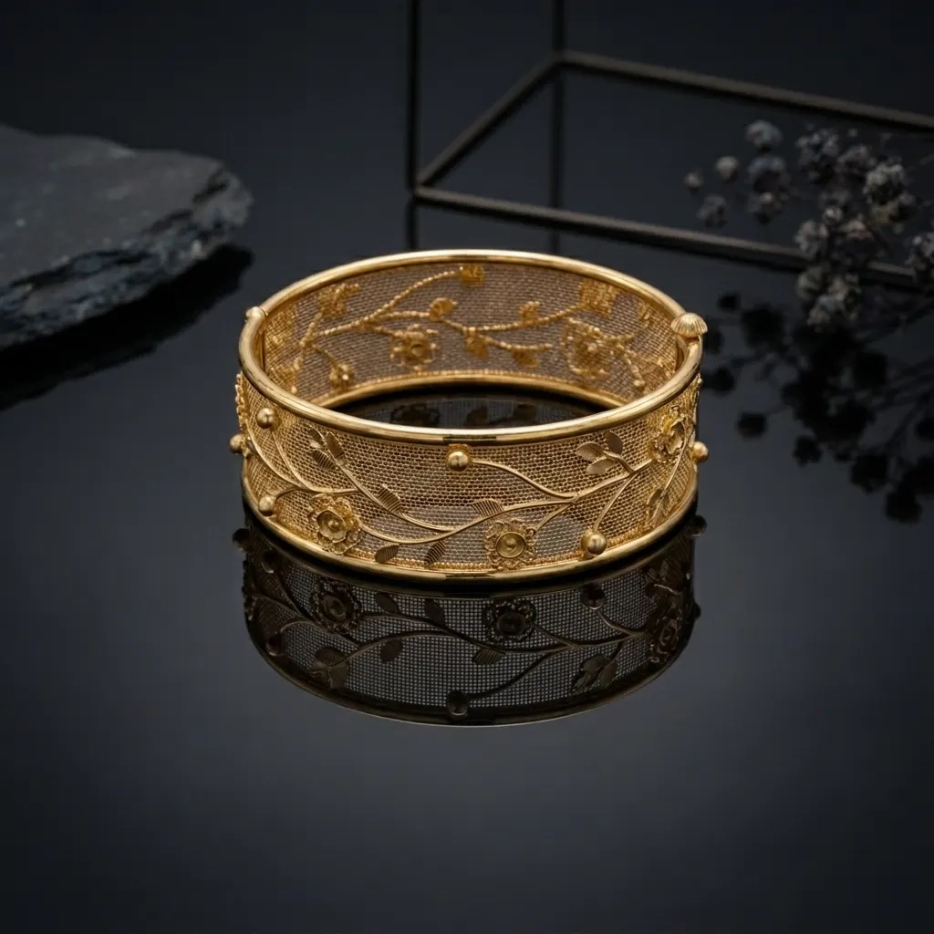 Broad handcrafted filigree kada bangle with a floral vine pattern
